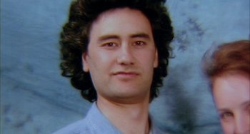 Movie still from “Eagle vs Shark” (2007), directed by Taika Waititi – A person wearing a blue shirt; Extreme Close Up shot, High angle