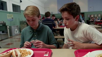 Movie still from “Earth to Echo” (2014), directed by Dave Green – Two young men sitting at a table eating french fries; Medium shot, High angle