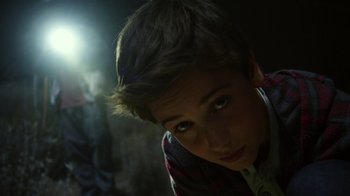 Movie still from “Earth to Echo” (2014), directed by Dave Green – A young boy is looking into the camera; Close Up shot, Over the shoulder angle