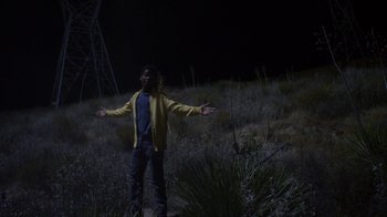 Movie still from “Earth to Echo” (2014), directed by Dave Green – A man standing in the middle of a field at night; Wide shot, Low angle