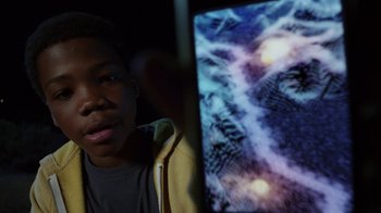 Movie still from “Earth to Echo” (2014), directed by Dave Green – A young man looking at a computer screen; Close Up shot, Overhead angle