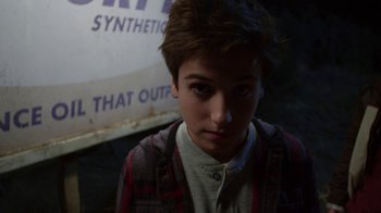 Movie still from “Earth to Echo” (2014), directed by Dave Green – A young boy with a plaid shirt is looking at the camera; Close Up shot, Over the shoulder angle