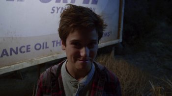 Movie still from “Earth to Echo” (2014), directed by Dave Green – A young man is smiling for the camera; Close Up shot, Over the shoulder angle