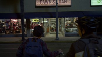 Movie still from “Earth to Echo” (2014), directed by Dave Green – A person riding a bike down a street at night; Wide shot, High angle