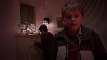 Movie still from “Earth to Echo” (2014), directed by Dave Green – Two young boys are standing in a room; Medium shot, Over the shoulder angle