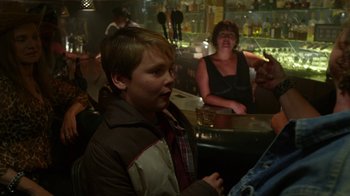 Movie still from “Earth to Echo” (2014), directed by Dave Green – A young boy sitting at a table in front of a woman; Medium shot, Over the shoulder angle