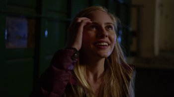 Movie still from “Earth to Echo” (2014), directed by Dave Green – A beautiful young lady with long blonde hair smiling; Close Up shot, Over the shoulder angle
