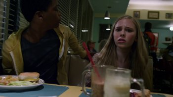 Movie still from “Earth to Echo” (2014), directed by Dave Green – A woman sitting at a table in front of a man; Close Up shot, Over the shoulder angle