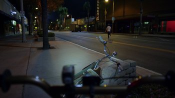Movie still from “Earth to Echo” (2014), directed by Dave Green – A bicycle parked on the side of the street; Extreme Wide shot, High angle
