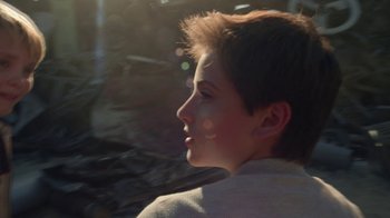 Movie still from “Earth to Echo” (2014), directed by Dave Green – A young man with a short haircut looks out the window; Close Up shot, Low angle