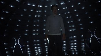 Movie still from “Earth to Echo” (2014), directed by Dave Green – A man standing in front of a wall of lights; Wide shot, Low angle