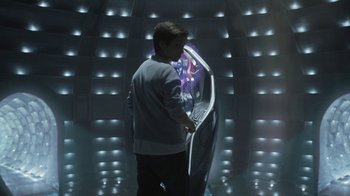 Movie still from “Earth to Echo” (2014), directed by Dave Green – A man standing in front of an illuminated screen; Medium shot, Over the shoulder angle