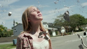 Movie still from “Earth to Echo” (2014), directed by Dave Green – A woman holding a wrench up to her face; Close Up shot, Low angle
