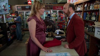 Movie still from “Eating Raoul” (1982), directed by Paul Bartel – A man and a woman talking to each other in a store; Medium shot, Over the shoulder angle