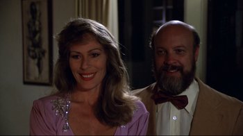 Movie still from “Eating Raoul” (1982), directed by Paul Bartel – A man and a woman standing next to each other; Close Up shot, Low angle