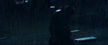 Movie still from “El Chicano” (2018), directed by Ben Hernandez Bray – A person riding a motorcycle in the rain at night; Wide shot, Low angle