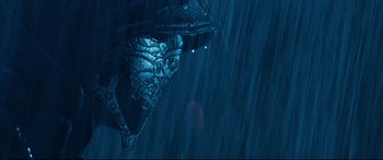 Movie still from “El Chicano” (2018), directed by Ben Hernandez Bray – View of the head of a statue in the rain; Extreme Close Up shot, Low angle