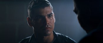 Movie still from “El Chicano” (2018), directed by Ben Hernandez Bray – A man's face with water on his face; Close Up shot, Low angle