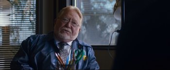 Movie still from “El Chicano” (2018), directed by Ben Hernandez Bray – An older man sitting in front of a window; Close Up shot, Over the shoulder angle