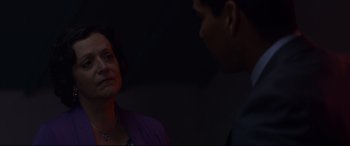 Movie still from “El Chicano” (2018), directed by Ben Hernandez Bray – A woman and a man talking in a dark room; Close Up shot, Over the shoulder angle
