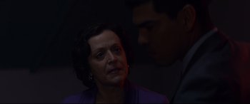 Movie still from “El Chicano” (2018), directed by Ben Hernandez Bray – A man and a woman in a dark room; Close Up shot, Over the shoulder angle