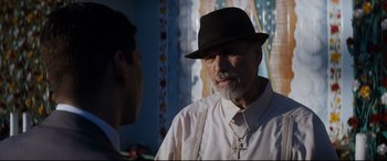 Movie still from “El Chicano” (2018), directed by Ben Hernandez Bray – An older man wearing a black hat talking to a younger man; Close Up shot, Over the shoulder angle