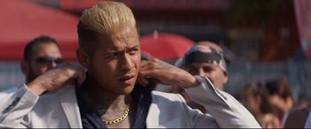 Movie still from “El Chicano” (2018), directed by Ben Hernandez Bray – A man with blonde hair is getting his hair cut; Close Up shot, Over the shoulder angle