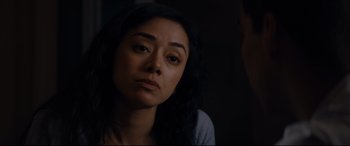 Movie still from “El Chicano” (2018), directed by Ben Hernandez Bray – A person sitting in front of a wall; Close Up shot, Over the shoulder angle