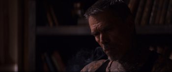 Movie still from “El Chicano” (2018), directed by Ben Hernandez Bray – A person with a tattoo on his arm; Close Up shot, Over the shoulder angle