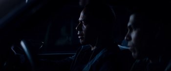 Movie still from “El Chicano” (2018), directed by Ben Hernandez Bray – A man sitting in a car listening to music; Close Up shot, Over the shoulder angle