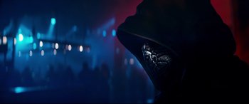 Movie still from “El Chicano” (2018), directed by Ben Hernandez Bray – A person wearing a hood in a dark room; Close Up shot, Low angle