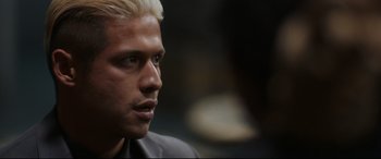 Movie still from “El Chicano” (2018), directed by Ben Hernandez Bray – A person with blond hair; Close Up shot, Over the shoulder angle
