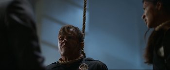 Movie still from “El Chicano” (2018), directed by Ben Hernandez Bray – A man with a rope hanging from his neck; Close Up shot, Low angle