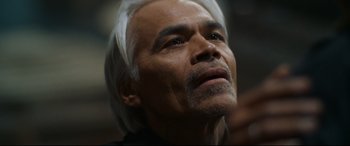 Movie still from “El Chicano” (2018), directed by Ben Hernandez Bray – An older man with white hair looking upward; Close Up shot, Low angle