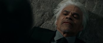 Movie still from “El Chicano” (2018), directed by Ben Hernandez Bray – An older man with white hair and a black suit; Close Up shot, Overhead angle