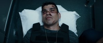 Movie still from “El Chicano” (2018), directed by Ben Hernandez Bray – A person laying in a bed; Close Up shot, Overhead angle