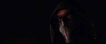 Movie still from “El Chicano” (2018), directed by Ben Hernandez Bray – A man wearing a mask and a hood; Close Up shot, Low angle