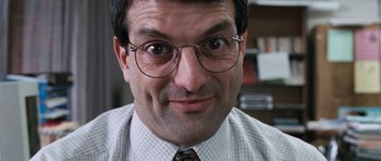 Movie still from “Election” (1999), directed by Alexander Payne – A person wearing glasses and a tie; Close Up shot, Low angle