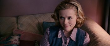 Movie still from “Election” (1999), directed by Alexander Payne – A person sitting on a couch; Close Up shot, Over the shoulder angle