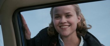 Movie still from “Election” (1999), directed by Alexander Payne – A young woman smiles while looking out a car window; Close Up shot, Low angle