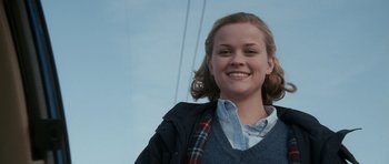Movie still from “Election” (1999), directed by Alexander Payne – A young woman smiles for the camera; Close Up shot, Low angle
