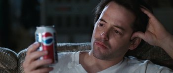 Movie still from “Election” (1999), directed by Alexander Payne – A man looking at a can of soda in his hand; Close Up shot, High angle
