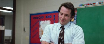Movie still from “Election” (1999), directed by Alexander Payne – A man standing in front of a red and blue wall; Close Up shot, Low angle