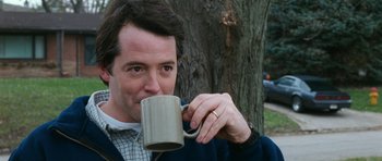 Movie still from “Election” (1999), directed by Alexander Payne – A person drinking a cup of coffee; Close Up shot, Low angle