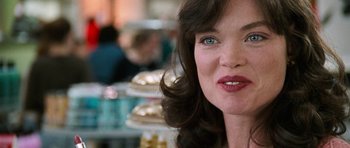 Movie still from “Election” (1999), directed by Alexander Payne – A woman's face in front of plates of food; Close Up shot, Over the shoulder angle