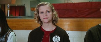 Movie still from “Election” (1999), directed by Alexander Payne – A young woman with blonde curly hair wearing a jacket; Close Up shot, Low angle