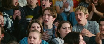 Movie still from “Election” (1999), directed by Alexander Payne – A group of young people sitting in a room; Close Up shot, High angle
