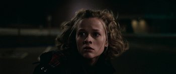 Movie still from “Election” (1999), directed by Alexander Payne – A young woman with blonde curly hair looking at the camera; Close Up shot, Low angle