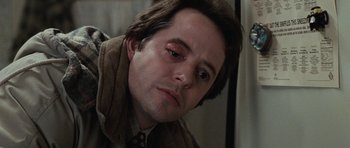 Movie still from “Election” (1999), directed by Alexander Payne – A person wearing a suit and tie; Close Up shot, Over the shoulder angle