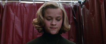 Movie still from “Election” (1999), directed by Alexander Payne – A person wearing a sweater; Close Up shot, Low angle